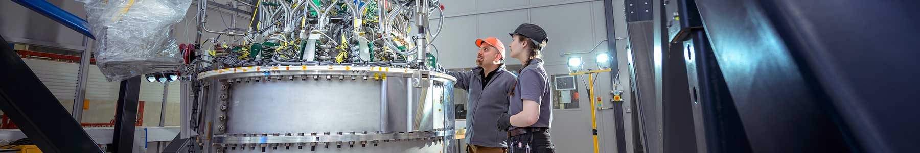 Engineers evaluating industrial process equipment during a technical assessment