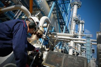 Engineer working with industrial chemical process equipment
