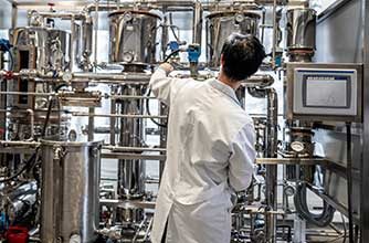 Engineer operating an instrumented pilot skid system